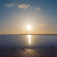 calm wide lake at the sunset