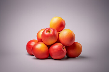 Nectarine fruit on a solid color background. Isolated object in photo studio. Commercial shot with copyspace.