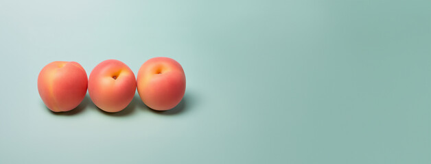 Peach fruit on a solid color background. Isolated object in photo studio. Commercial shot with copyspace.