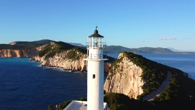 Detail of the white lighthouse or Cape Ducato Lefkas at sunset in the southern area of the island of Lefkada. Greece.