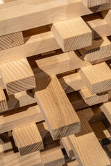 Wooden background. Big constructor from cut wooden blocks. Tower wall made of wood block