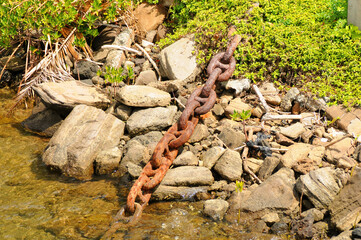Anchor Chain Fastened to Shore