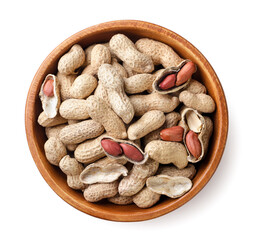 Peanut nuts in a shell wooden plate on a white background. top view