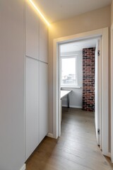 The interior of an empty modern apartment in bright colors immediately after renovation