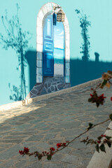 light and shadow on the blue house as a background