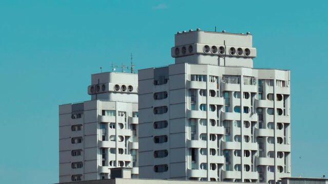Living building in 1980s PRL socialism style on blue sky background, Wroclaw, Poland
