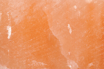 Himalayan salt stone closeup background, texture of natural pink salt crystal
