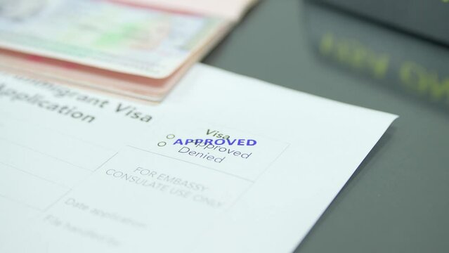 Close up visa application paper and stamp approved
