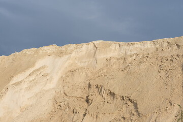 Fototapeta na wymiar Sand hills on a blue sky background