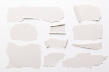 Art collage of pieces of ripped paper with torn edges. Sticky notes collection white colors, shreds of notebook pages. Abstract background