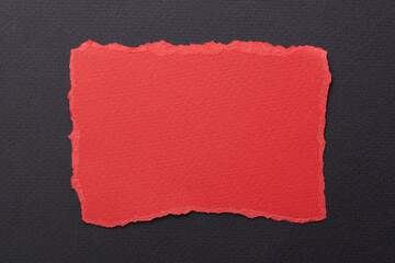 Art collage of pieces of ripped paper with torn edges. Sticky notes collection red black colors, shreds of notebook pages. Abstract background.