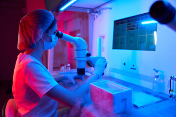 Young embryologist at work in a cryo-laboratory