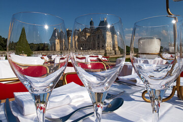 Sumptuous outdoor feast amidst castle's regal charm and natural splendor.