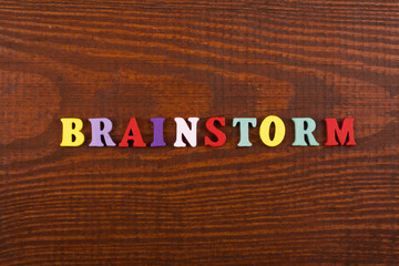 BRAINSTORMING word on wooden background composed from colorful abc alphabet block wooden letters, copy space for ad text. Learning english concept.