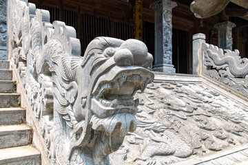 Low angle view of stairs and dragon sculpture of temple of Suoi Tien in the Red River Delta of Ninh Binh, Vietnam near Trang An (Halong Bay on land) 