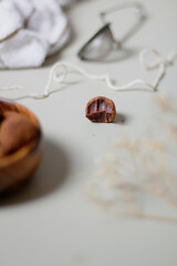 Chocolate truffles covered with cocoa powder. Gray background. Delicious dessert concept.