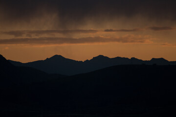 Picture of dramatic sunset in the Andes of Peru with heavy clouds. Concept of nature and climate change.