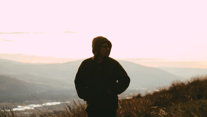 Photo of silhouette of a man in a dramatic sunset in the mountains of Peru. Concept of travel, nature and people.