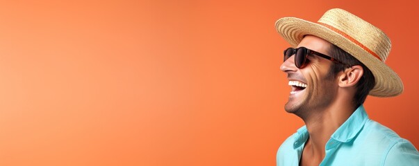Happy Australian Man with Sun Hat and Sunglasses on a Coral Background with Space for Copy.