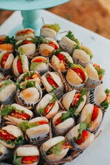 Photo of sandwiches on a party snack table. Concept of celebrations and food.