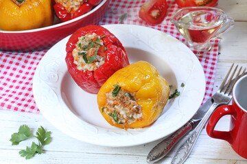 Stuffed peppers with minced meat and rice on a white background
