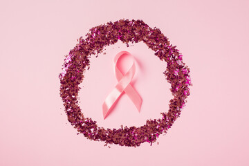Breast Cancer Awareness symbol - pink satin ribbon in circle of confetti