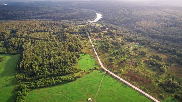 Forest and river drone aerial in sunny weather. 