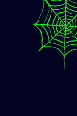 Green spider web on dark blue background. Creative concept.