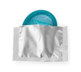 Condom in torn package on white background, top view. Safe sex