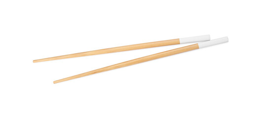 Pair of wooden chopsticks isolated on white, top view