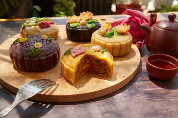 Mid Autumn Moon Cake on the wooden board under sunlight 