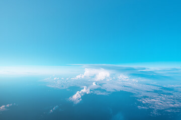 Beautiful blue cloudy sky from aerial view. Airplane view above clouds