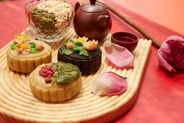 Mid-Autumn Festival food moon cake and tea on red background