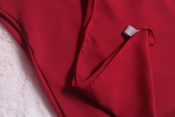 Piece of luxurious red satin fabric suitable for a textured background