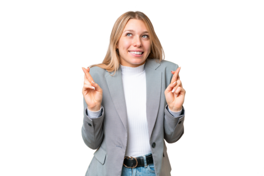Young pretty blonde woman over isolated chroma key background with fingers crossing and wishing the best