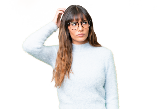 Young caucasian woman over isolated chroma key background having doubts while scratching head