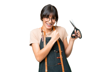 Young caucasian seamstress over isolated on chroma key background celebrating a victory