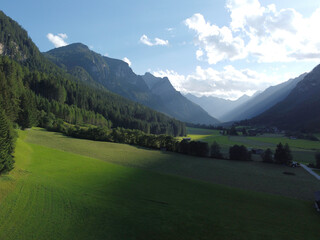 Fototapeta premium Mountains and meadows in a beautiful landscape in Austria at the Brenner Pass at sunset
