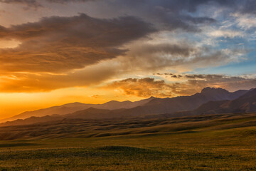 Dawn of the sun in the Dzungarian Alatau in the southeastern part of Kazakhstan