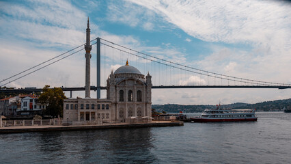 The view of Ortaköy mosque on the Bosphorus and the ferries standing in front of it. Istanbul Türkiye