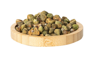 dried Capers in a wooden bowl