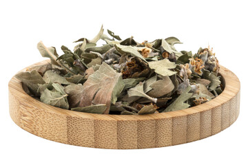 dried howthorn leaves in a wooden bowl