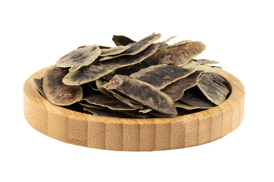dried senna occidentalis in a wooden bowl (aclik otu)