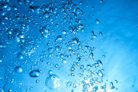 Plenty of air bubbles in blue water