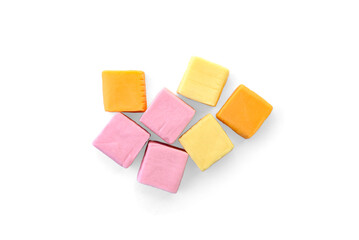 Pile of color square chewable candies isolated on white background.