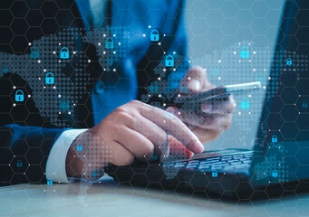 Businessman sitting working with laptop to protect customer cyber security Customer data and brainstorming are protected. Blue lock key hologram over working background