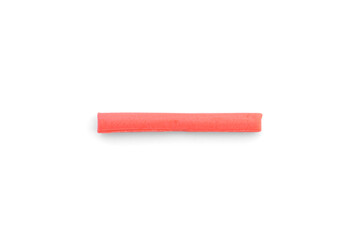 Red chewable candy sticks isolated on a white background.