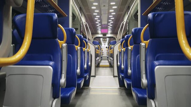 Interior of the modern high speed train driving on night route from Fiumicino airport to Termini railway stantion in Rome