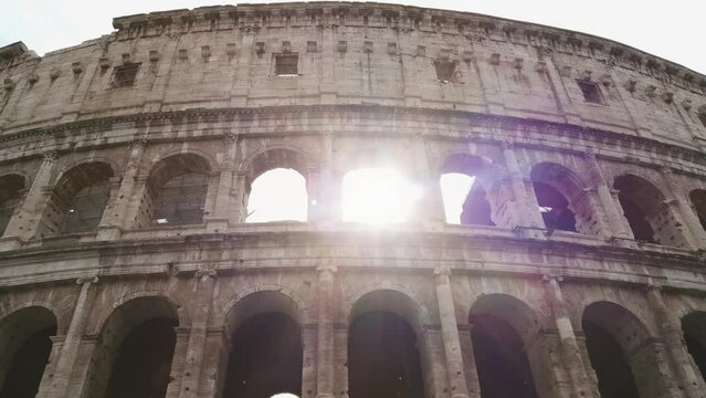 Sightseeing of facade of famous landmark Coliseum or Flavian Amphitheatre, Amphitheatrum Flavium or Colosseo, Rome, Italy