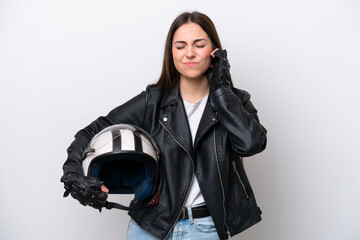 Young girl with a motorcycle helmet isolated on white background frustrated and covering ears